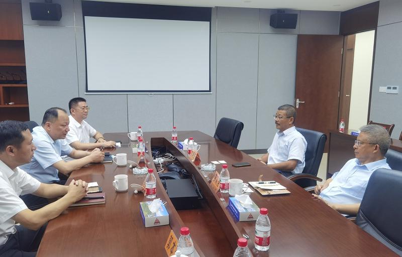周鸿拜访海南矿业股份有限公司董事长刘明东